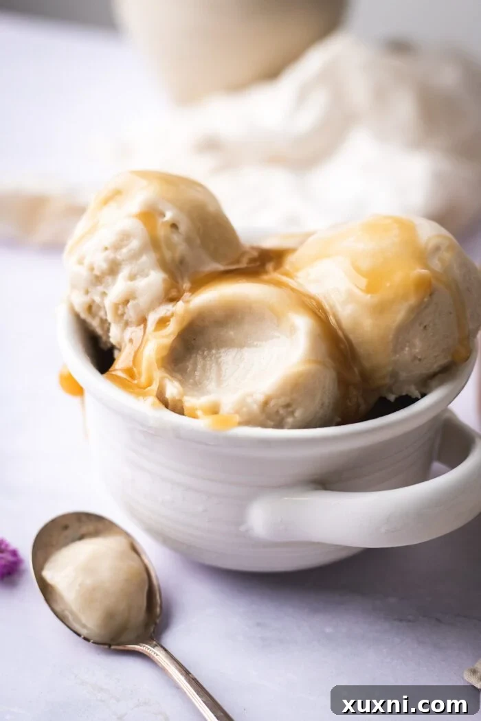 Bite out of vegan vanilla ice cream with texture