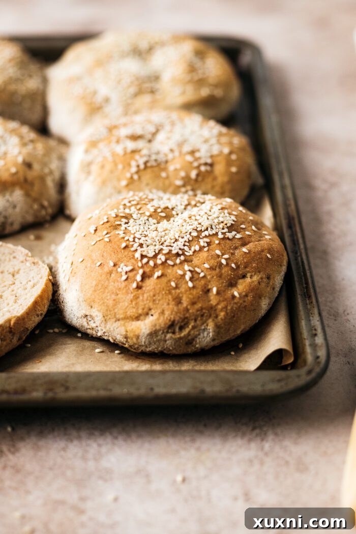 gluten free burger buns cooling on parchment paper