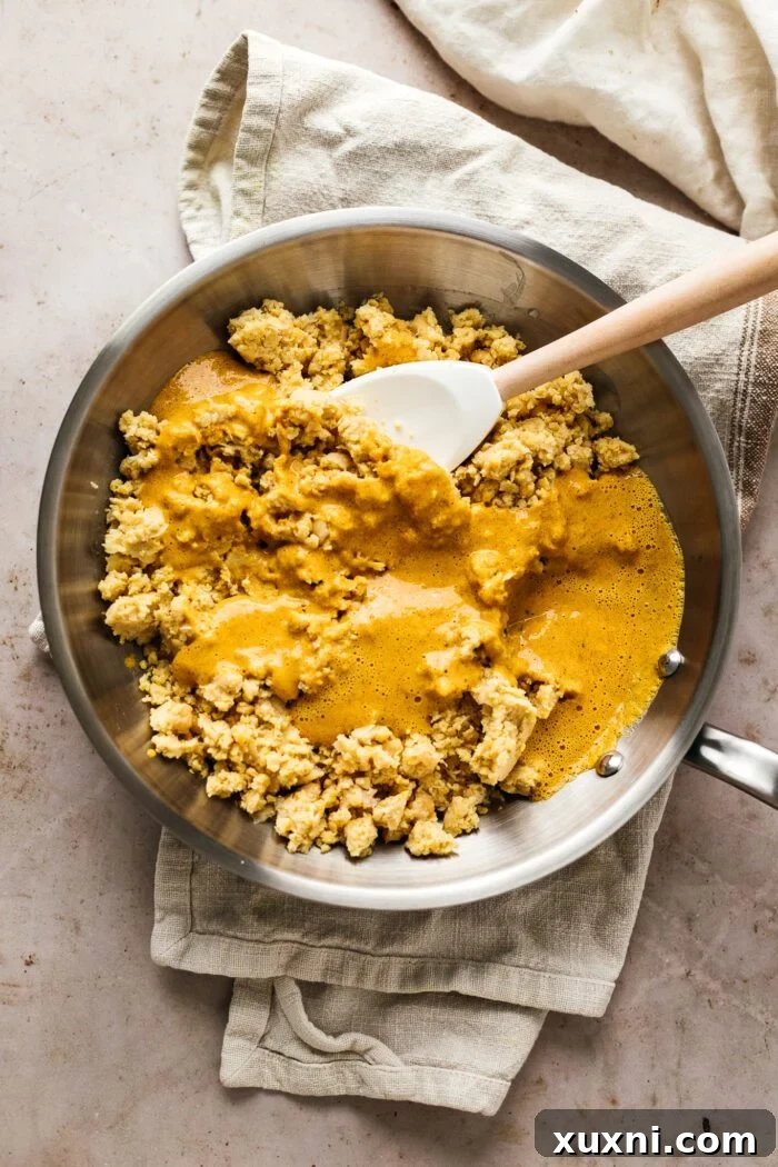 chickpea mixture cooking in a skillet