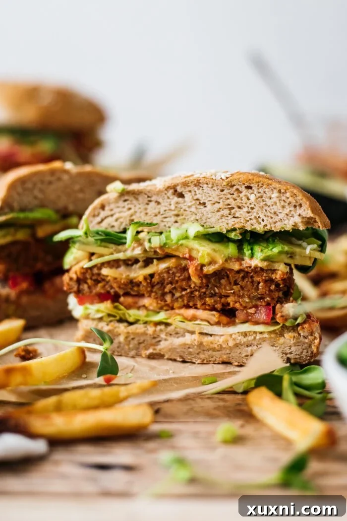 sliced open lentil mushroom burger on parchment paper
