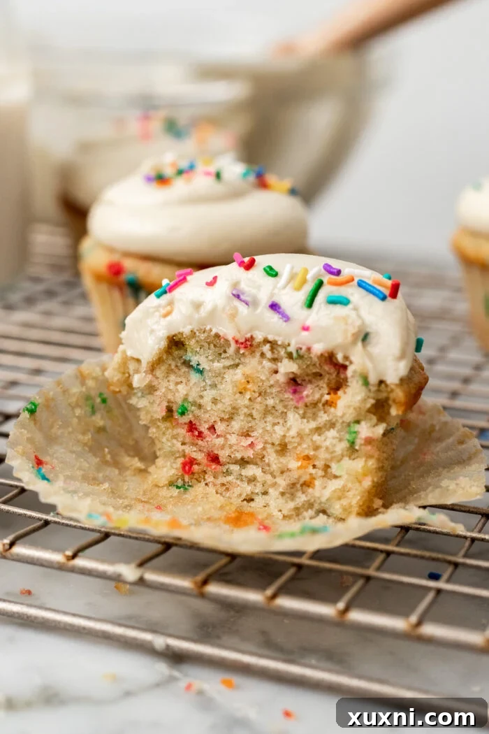 Vegan Funfetti Cupcakes Perfectly Moist for Four Days 4 sliced vegan funfetti cupcake