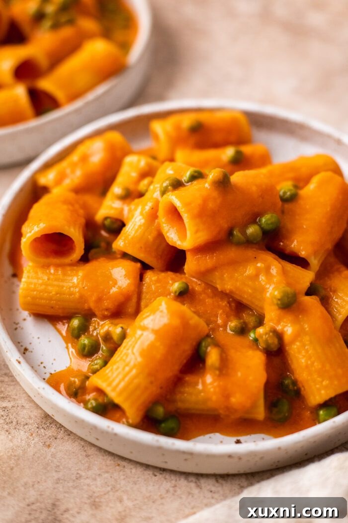 A close-up view of the creamy vegan vodka pasta, highlighting its appealing texture and fresh ingredients.