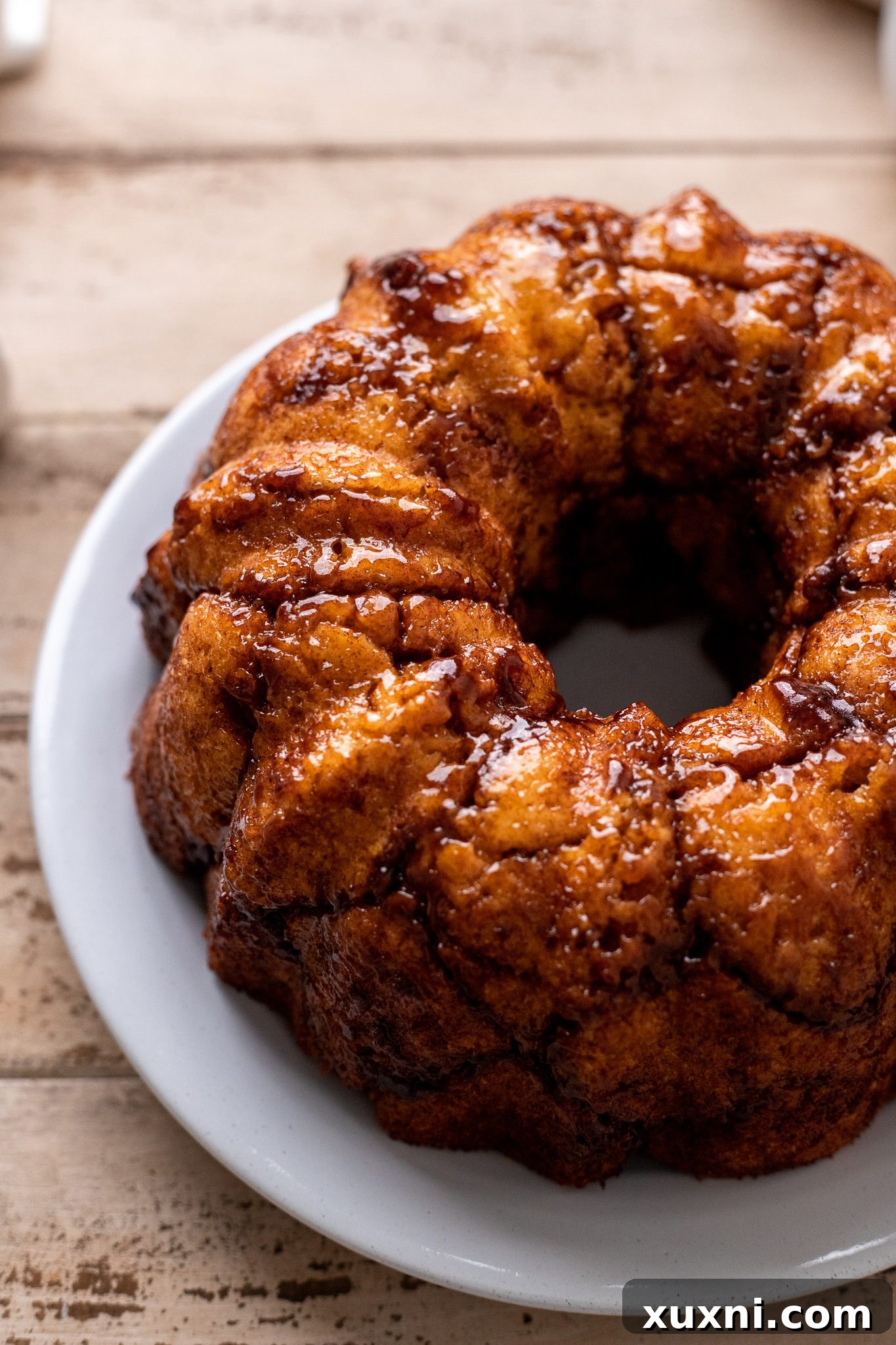 The Classic Soft and Fluffy Gluten-Free Monkey Bread 11 Baked vegan monkey bread, turned out onto a serving plate, ready for glazing.