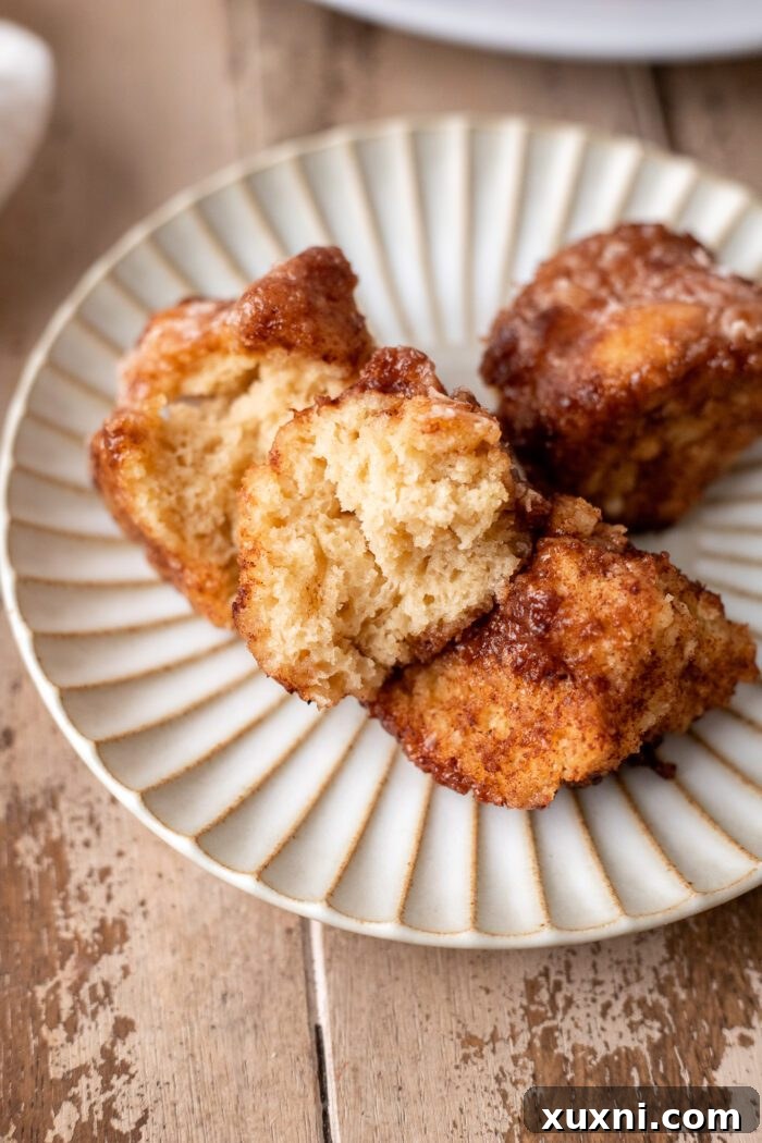 The Classic Soft and Fluffy Gluten-Free Monkey Bread 14 A single serving plate adorned with warm, glazed gluten-free vegan monkey bread, ready to be enjoyed.