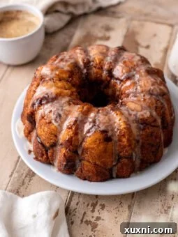 Gluten-free monkey bread on a plate with cinnamon sugar coating