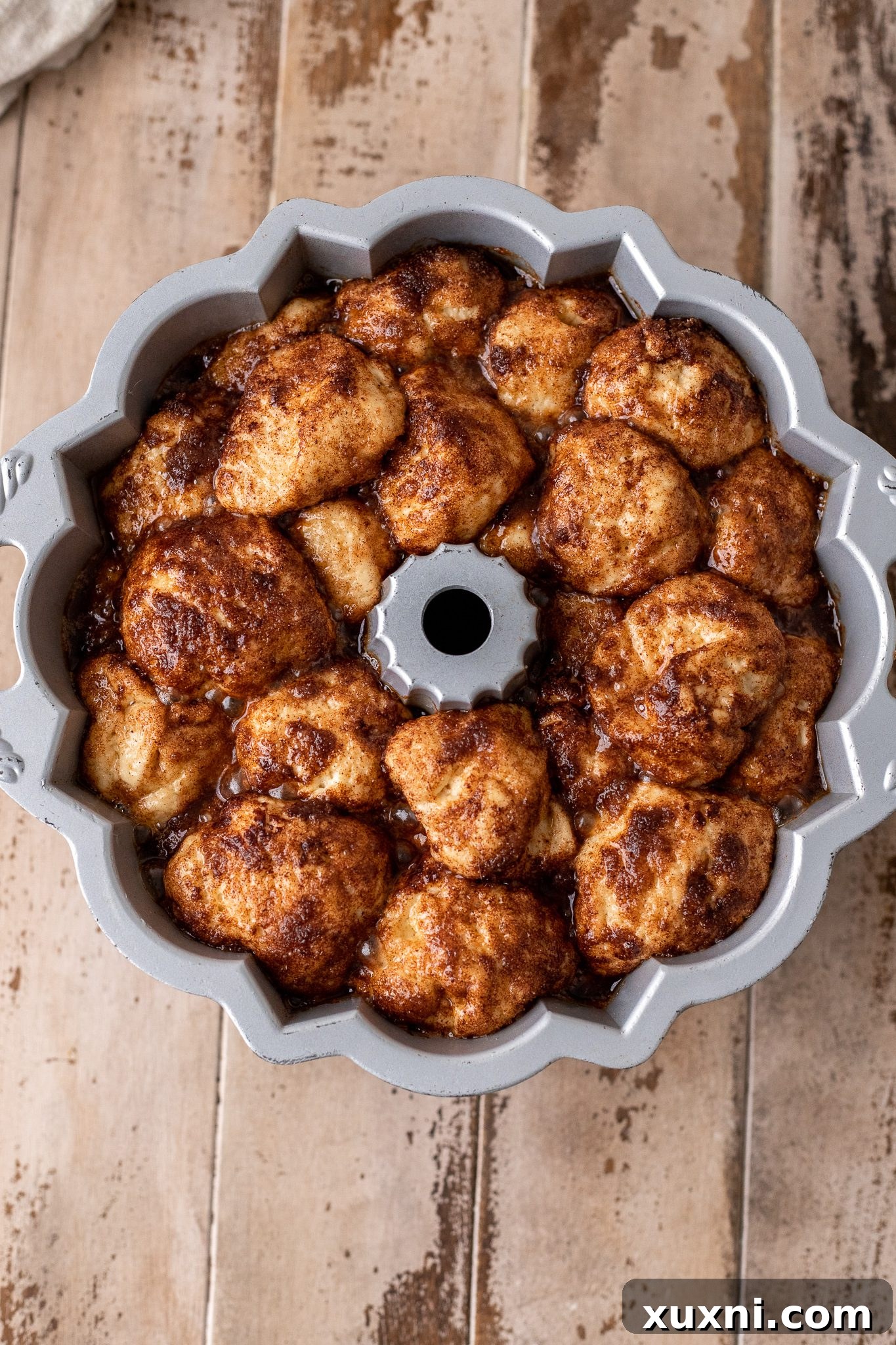 The Classic Soft and Fluffy Gluten-Free Monkey Bread 9 Perfectly risen gluten-free monkey bread dough, expanded and puffy in the bundt pan, ready to be baked.