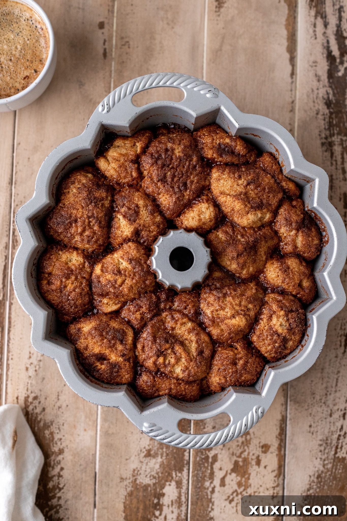 The Classic Soft and Fluffy Gluten-Free Monkey Bread 10 Freshly baked gluten-free monkey bread, golden brown and puffed, just out of the oven in its bundt pan.