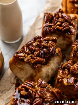Maple Vegan Sticky Buns on parchment paper