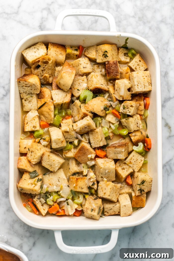 stuffing before baking, the mixed bread and vegetable ingredients in a casserole dish, ready for the oven