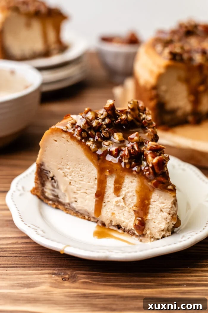 Ultimate Gooey Vegan Pecan Pie Cheesecake 2 A glorious slice of vegan pecan pie cheesecake, showcasing its creamy layers, gooey pecan filling, and crisp crust, on a plate, ready to be enjoyed.