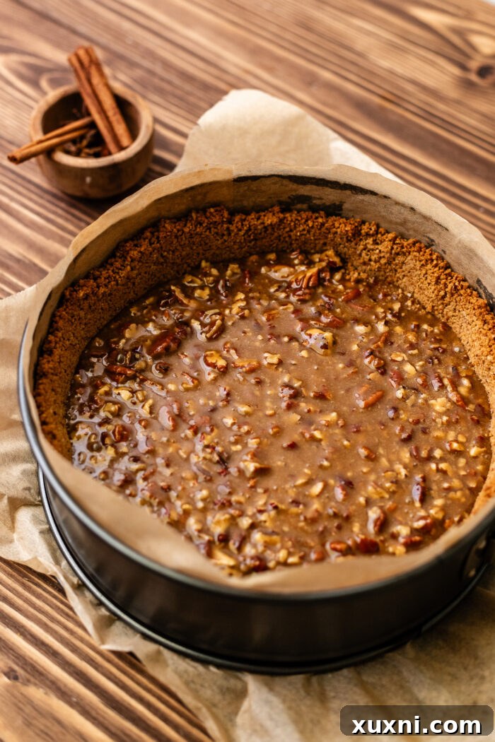 Ultimate Gooey Vegan Pecan Pie Cheesecake 11 Gooey pecan pie filling spread evenly inside the baked crust.