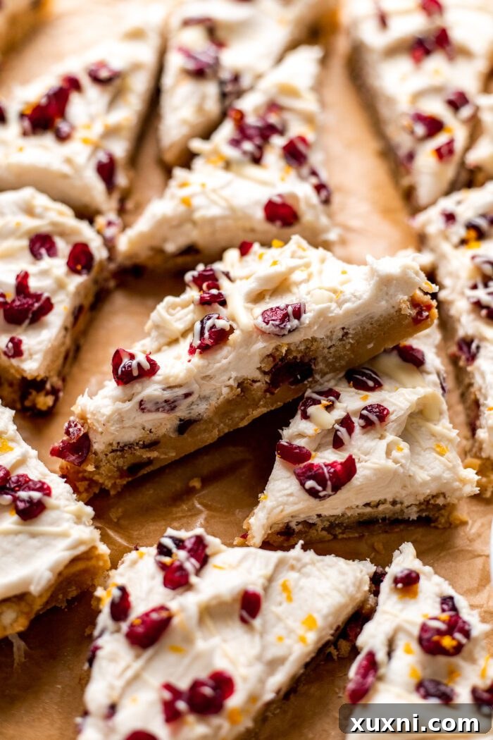 sliced vegan cranberry bliss bars, a festive holiday dessert