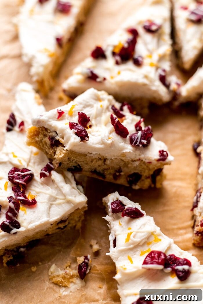 bitten vegan cranberry bliss bars with perfect frosting