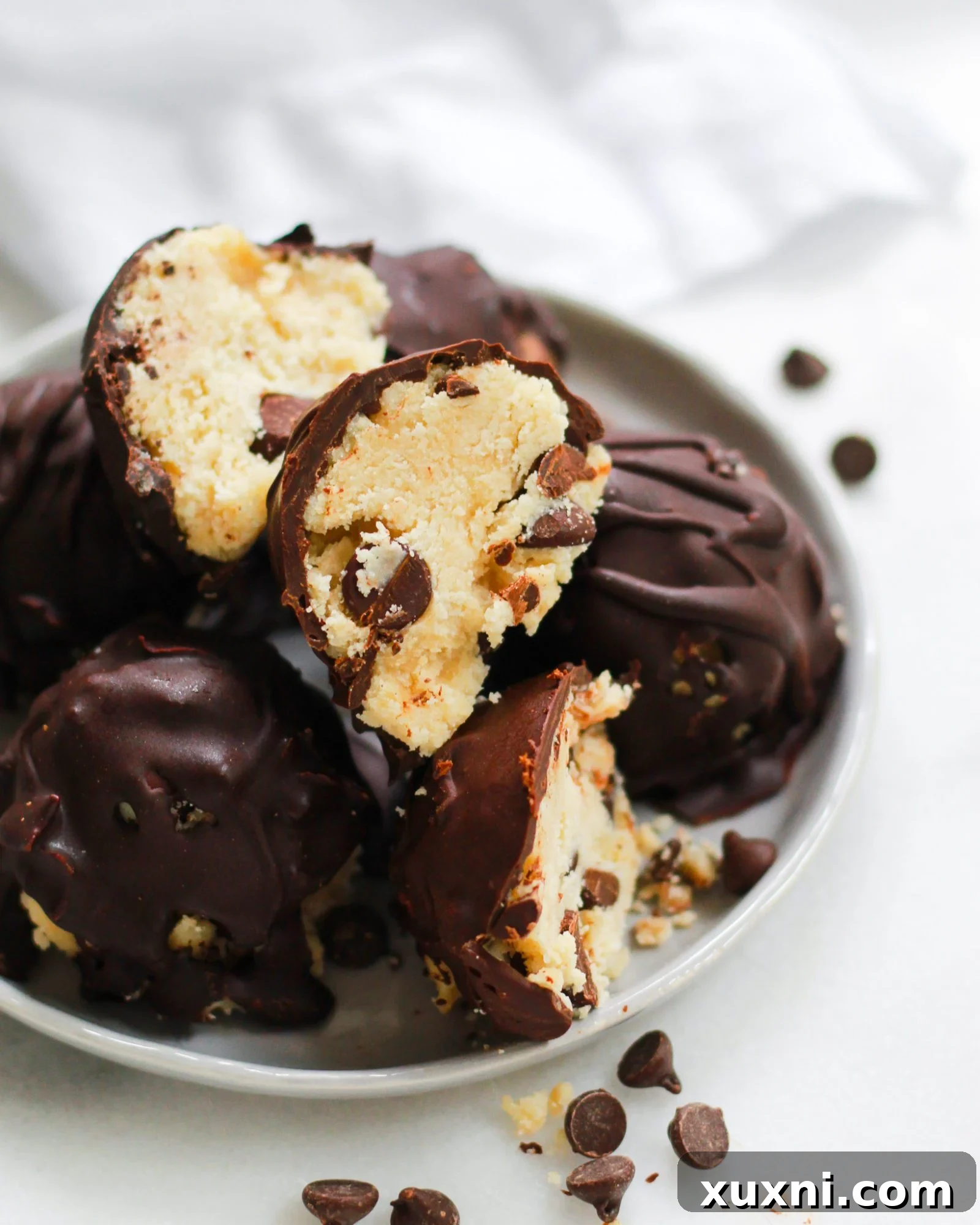 close up of Paleo chocolate chip cookie dough truffles on plate