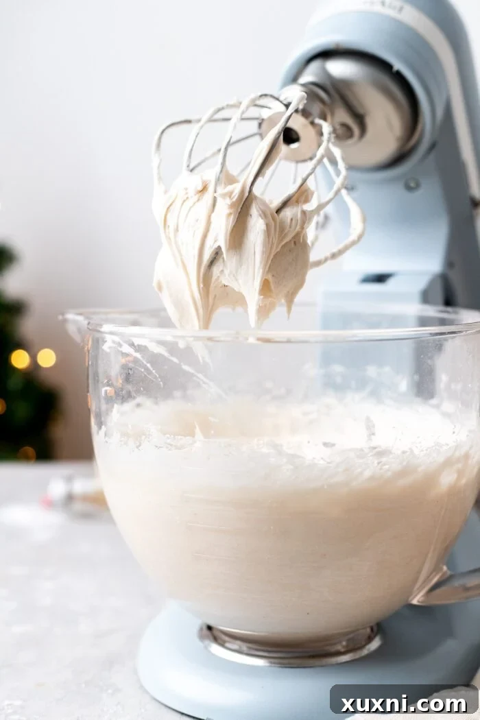 Mastering Pipeable Vegan Cream Cheese Frosting 4 stand mixer with vegan cream cheese frosting being made