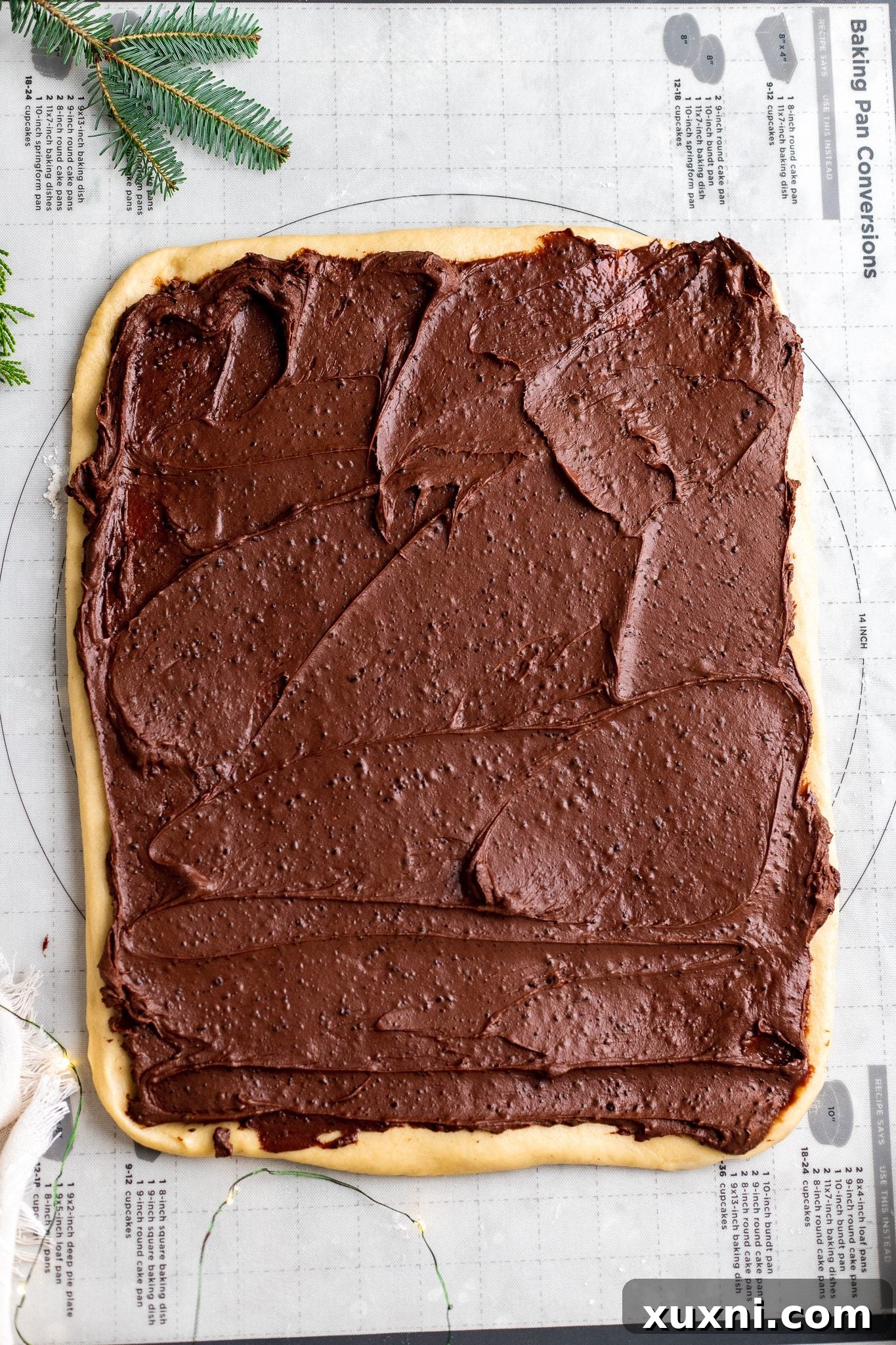 Babka dough generously spread with chocolate filling