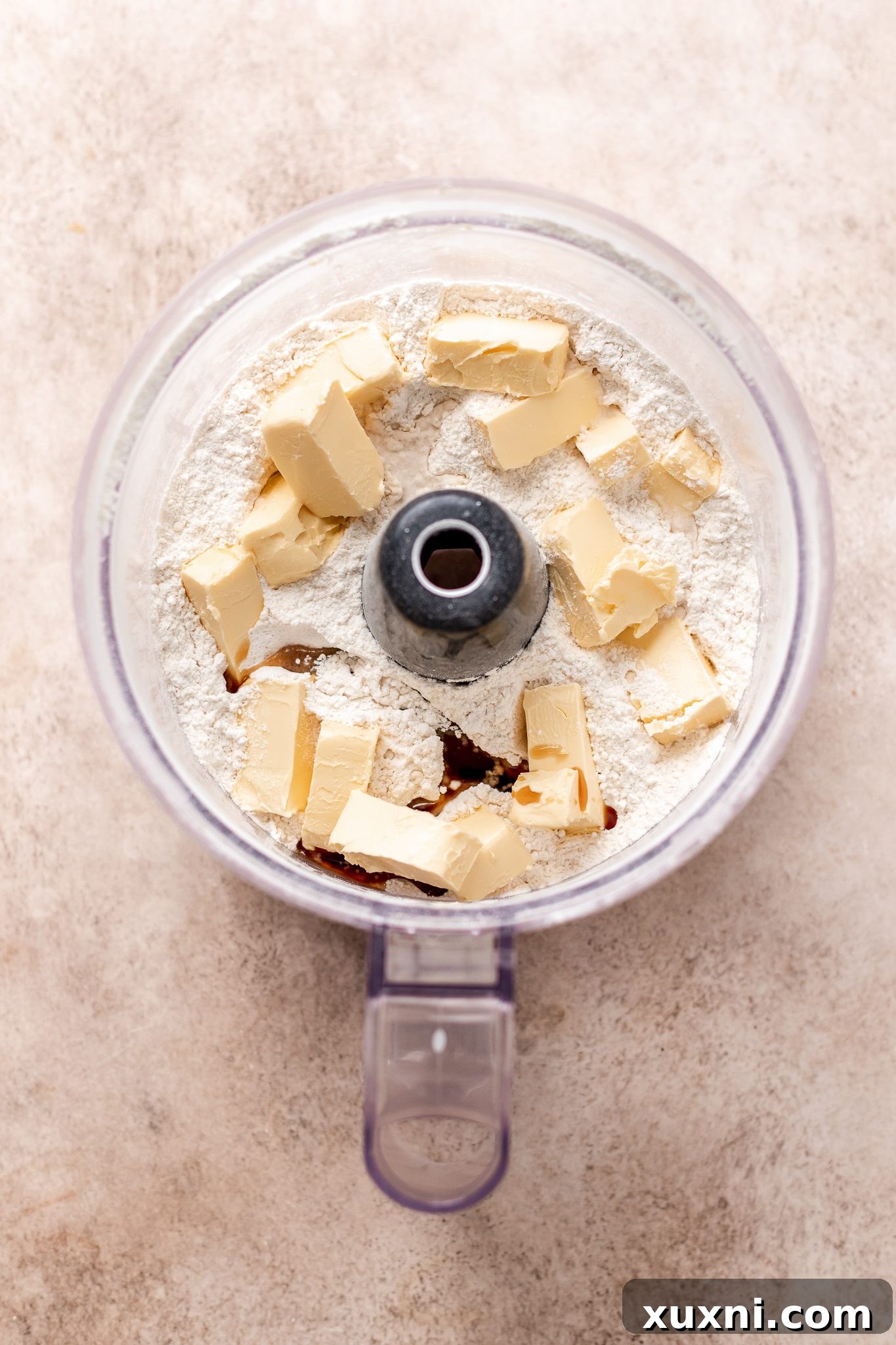 Process of making peppermint meltaway cookie dough, showing ingredients blending in a food processor.