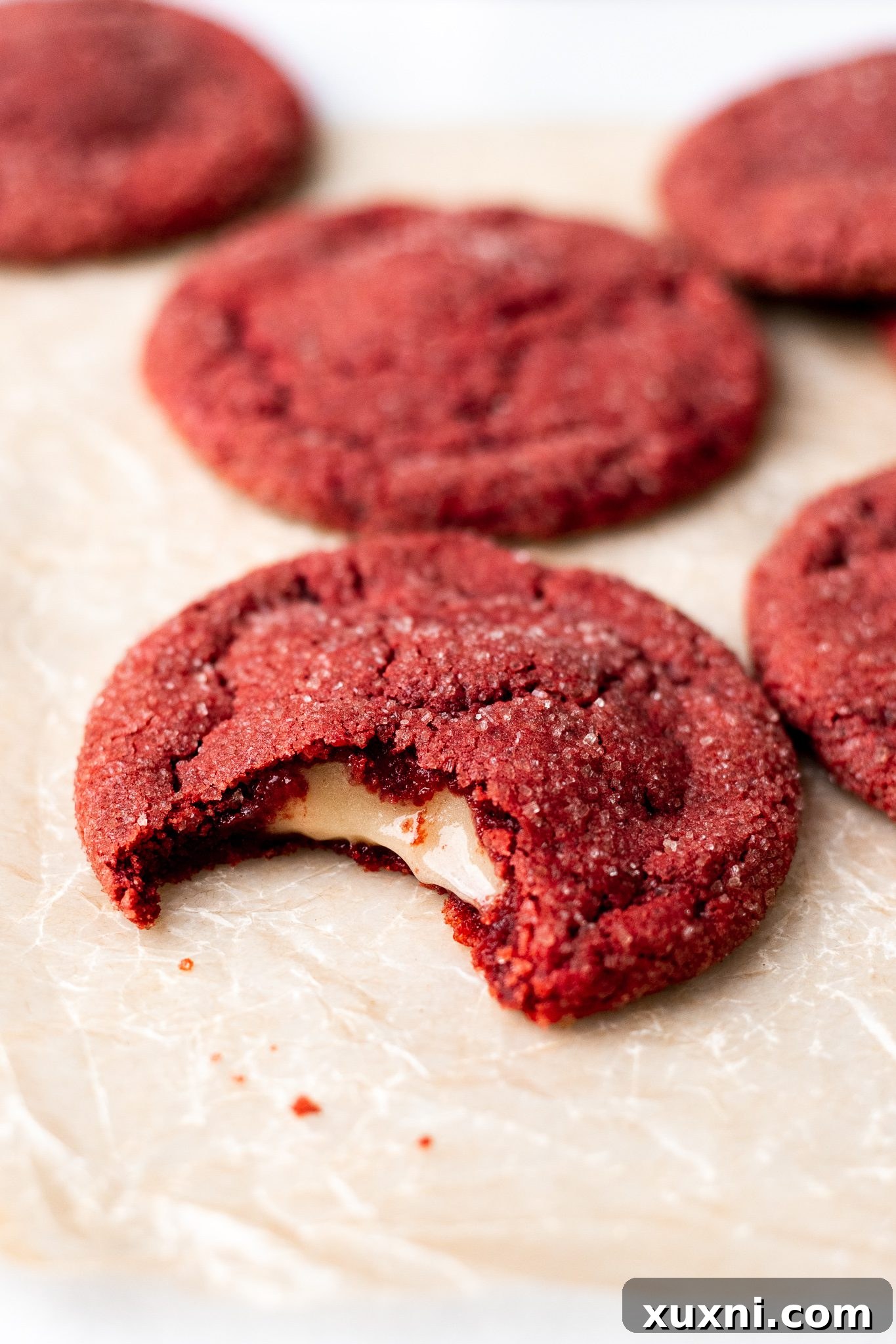 bitten red velvet cookie showing creamy center