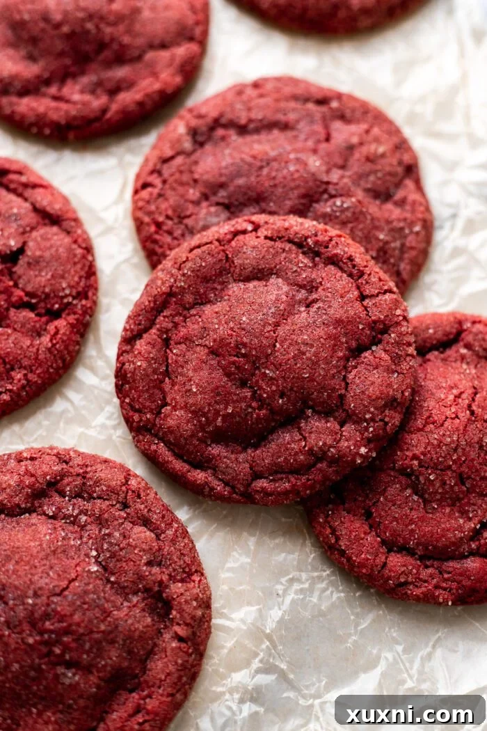 cream cheese stuffed red velvet cookies on parchment paper