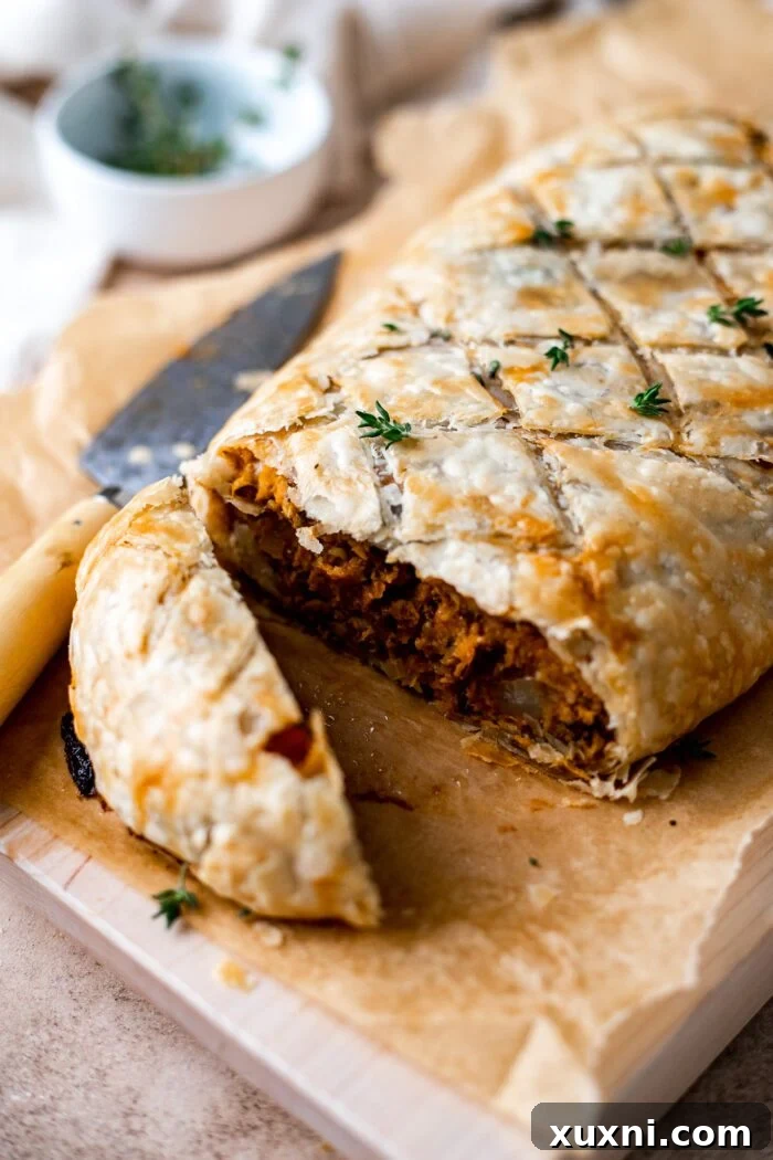 sliced Vegan Wellington on a cutting board
