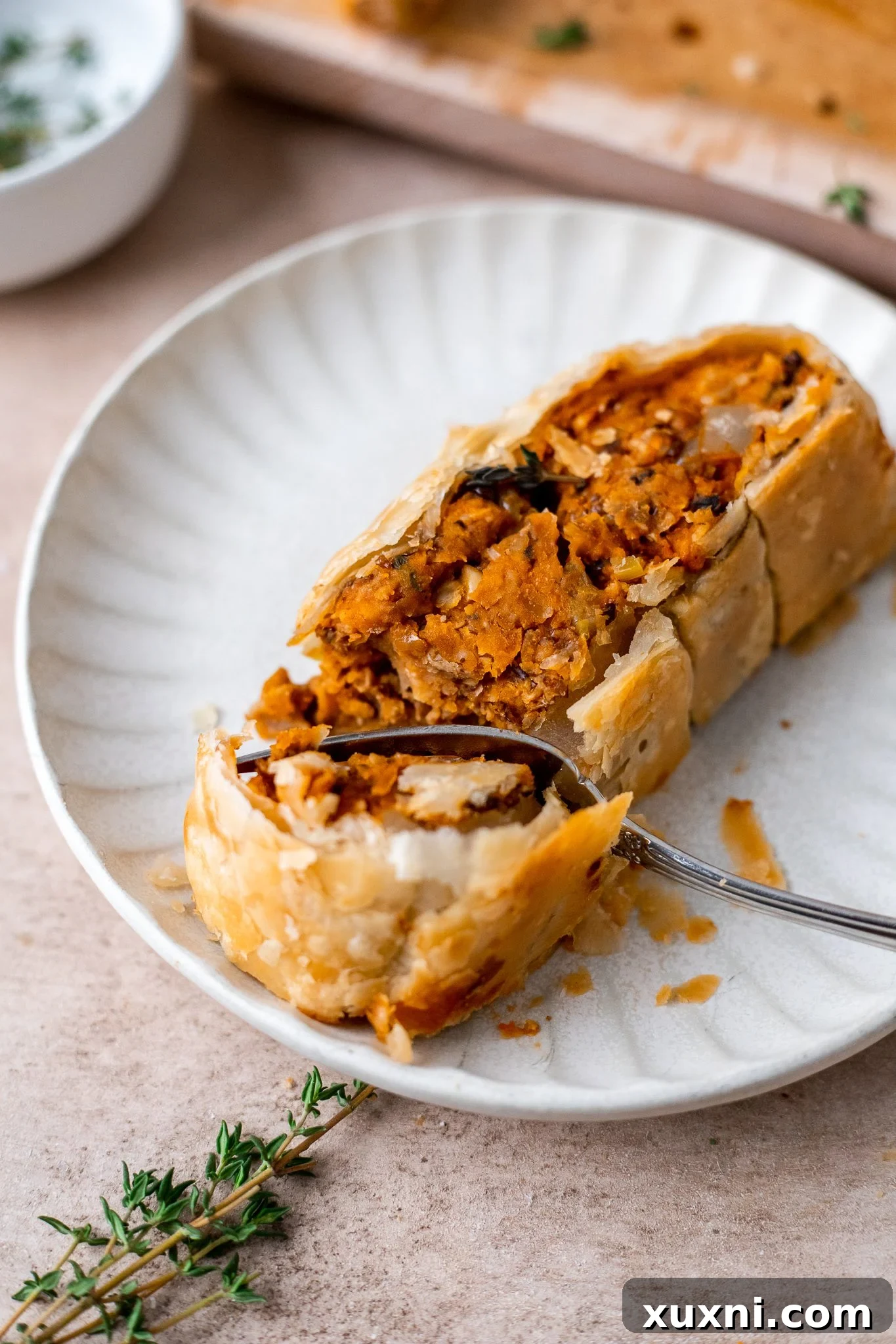 plate with a slice of Vegan Wellington
