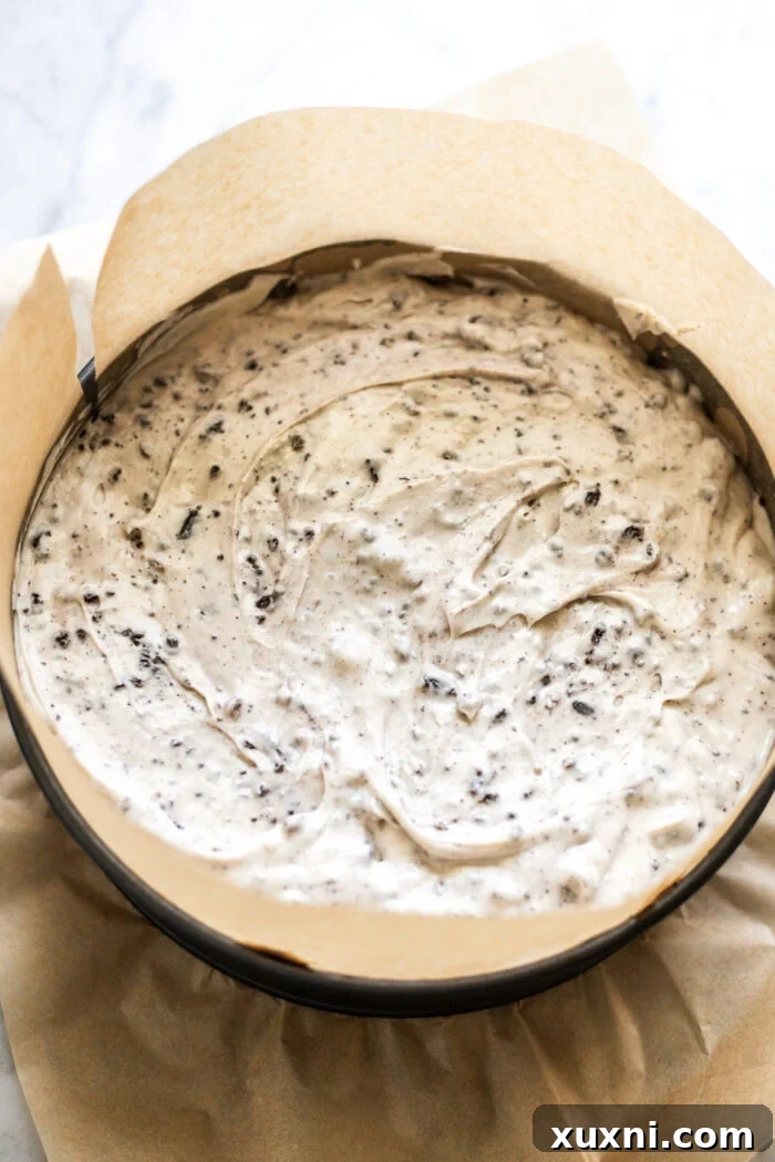 A vegan cheesecake being removed from the freezer, showing its perfectly set and chilled state.