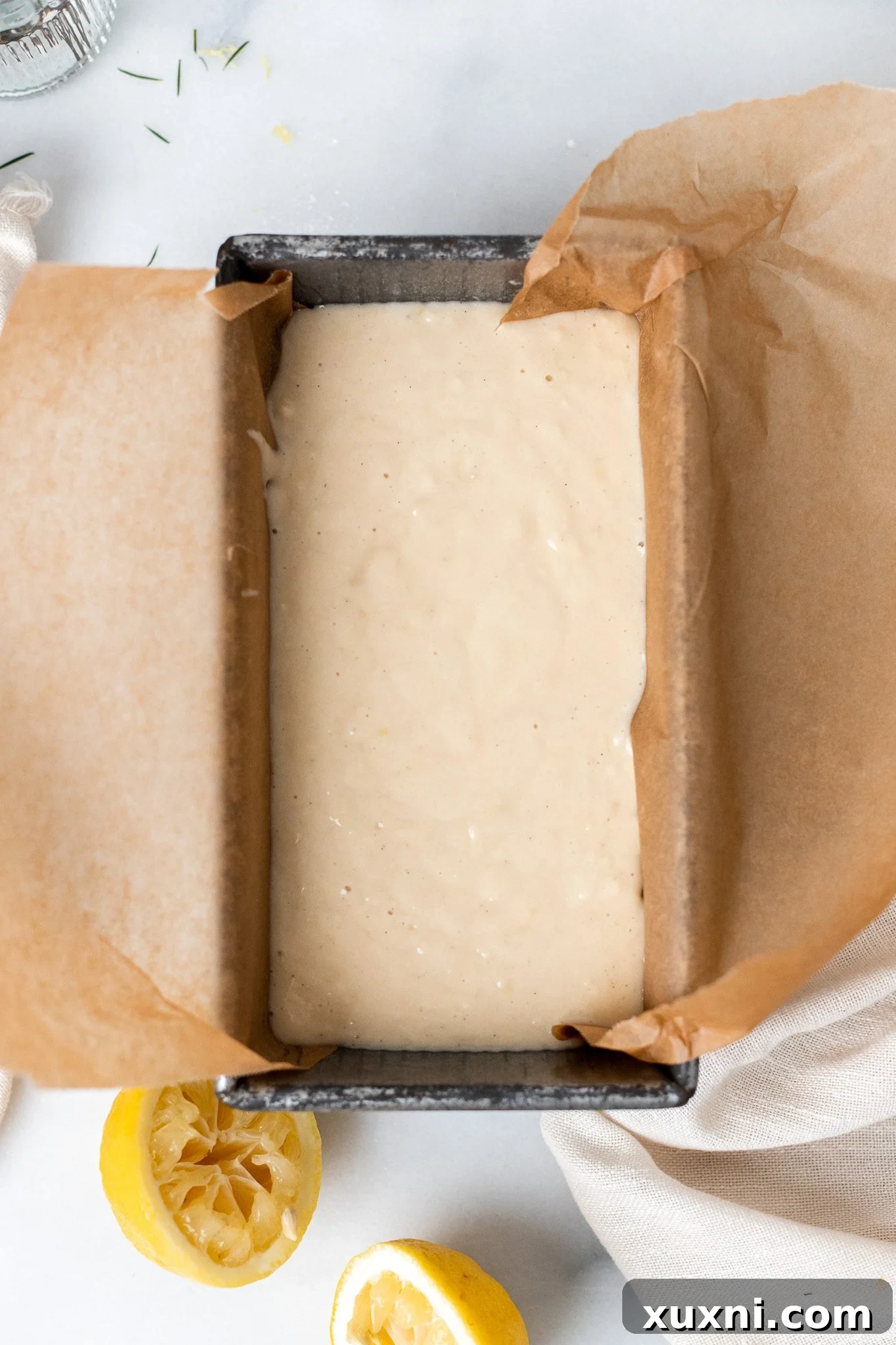 Unbaked vegan lemon pound cake batter in a loaf pan, ready for the oven.