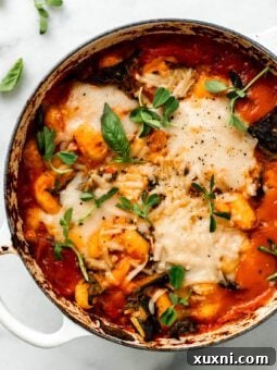 Rich and creamy vegan baked gnocchi in a Dutch oven