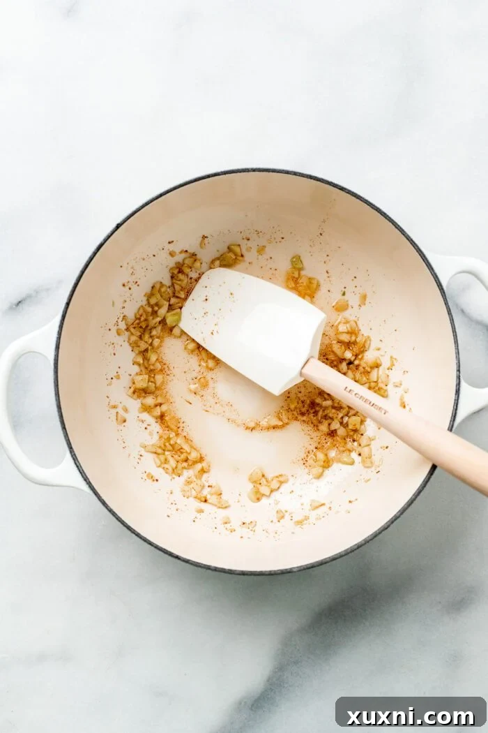 25-Minute No-Boil Vegan Cheesy Baked Gnocchi with Beans 5 Sautéing minced garlic in melted vegan butter in a Dutch oven.