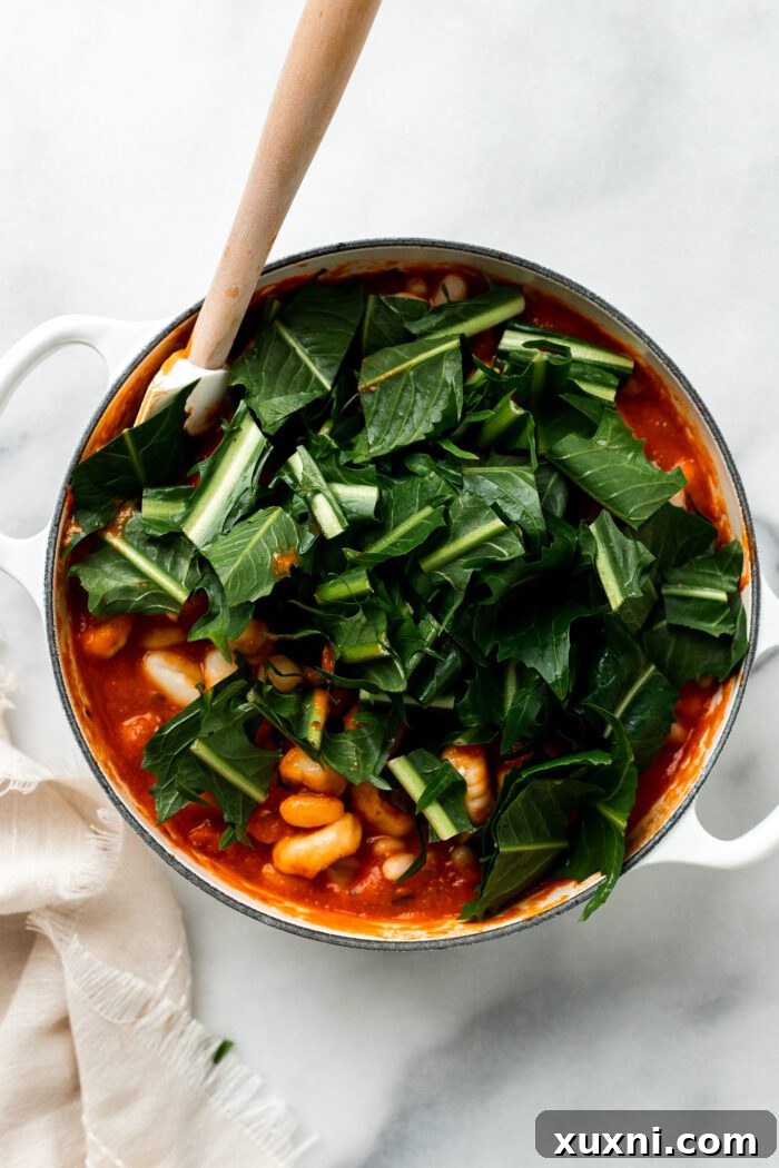 25-Minute No-Boil Vegan Cheesy Baked Gnocchi with Beans 8 Adding greens, uncooked gnocchi, and cannellini beans to the tomato sauce.