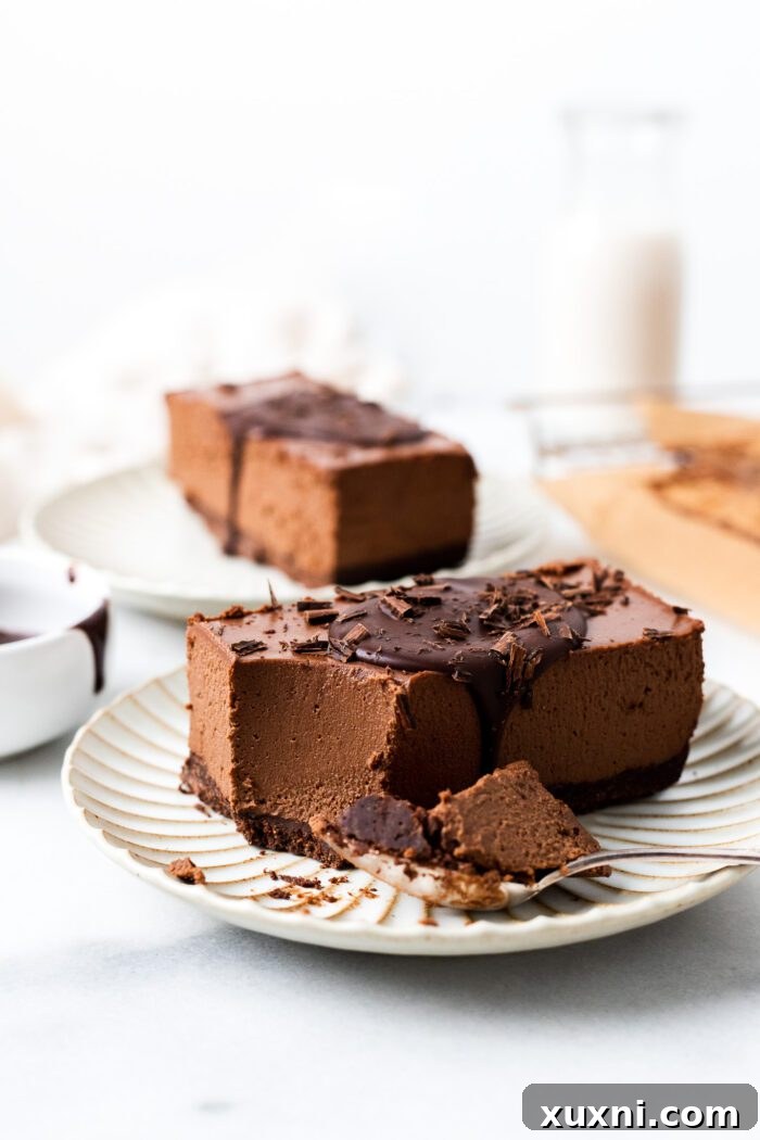 Decadent vegan mocha mousse bar with a bite taken out, resting on a plate