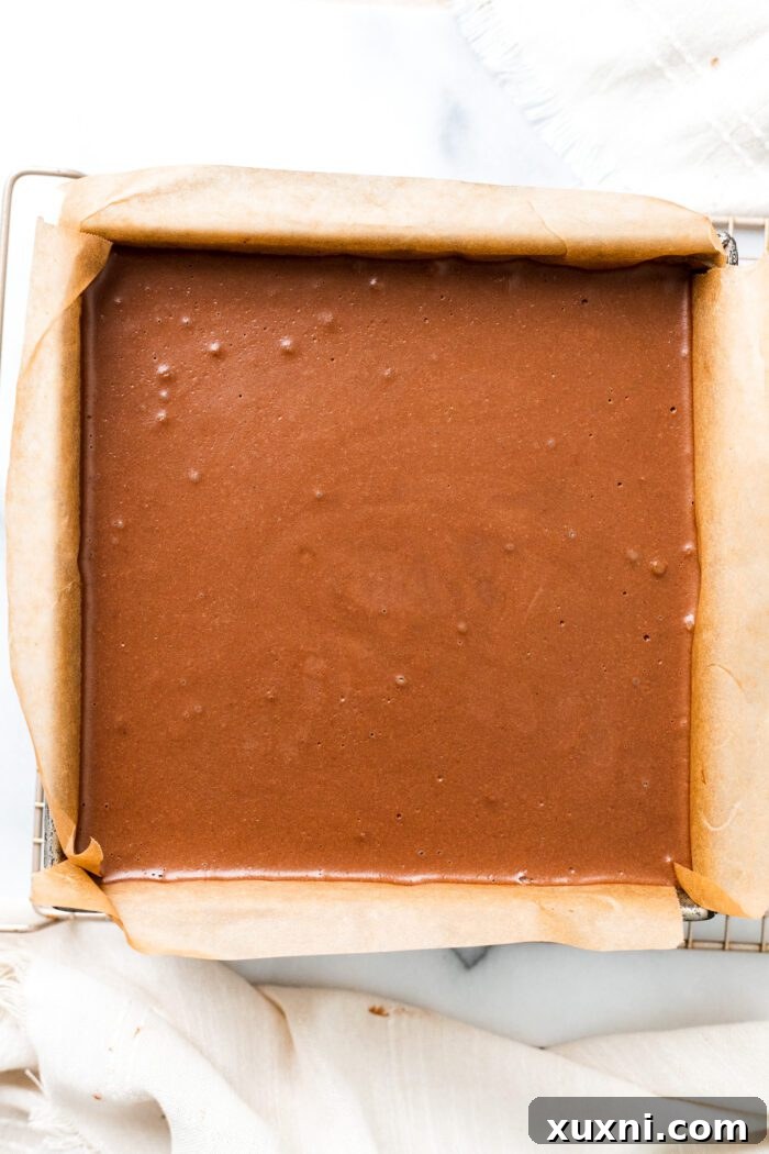 Chocolate mocha mousse bars layered in a pan, ready for chilling