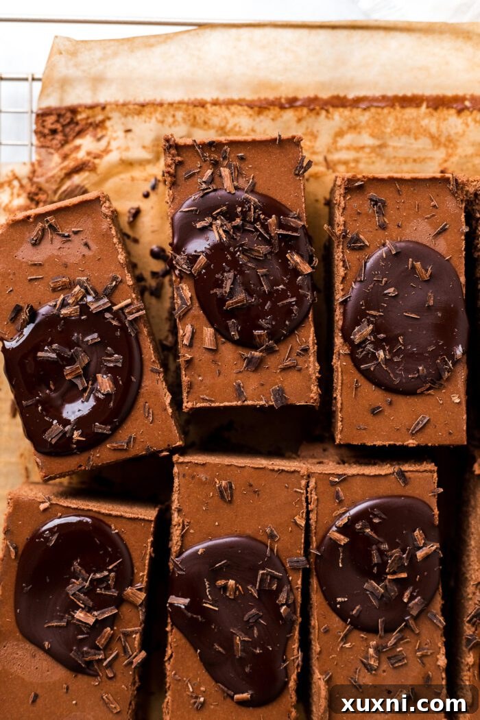 Sliced vegan chocolate mousse bars adorned with toppings