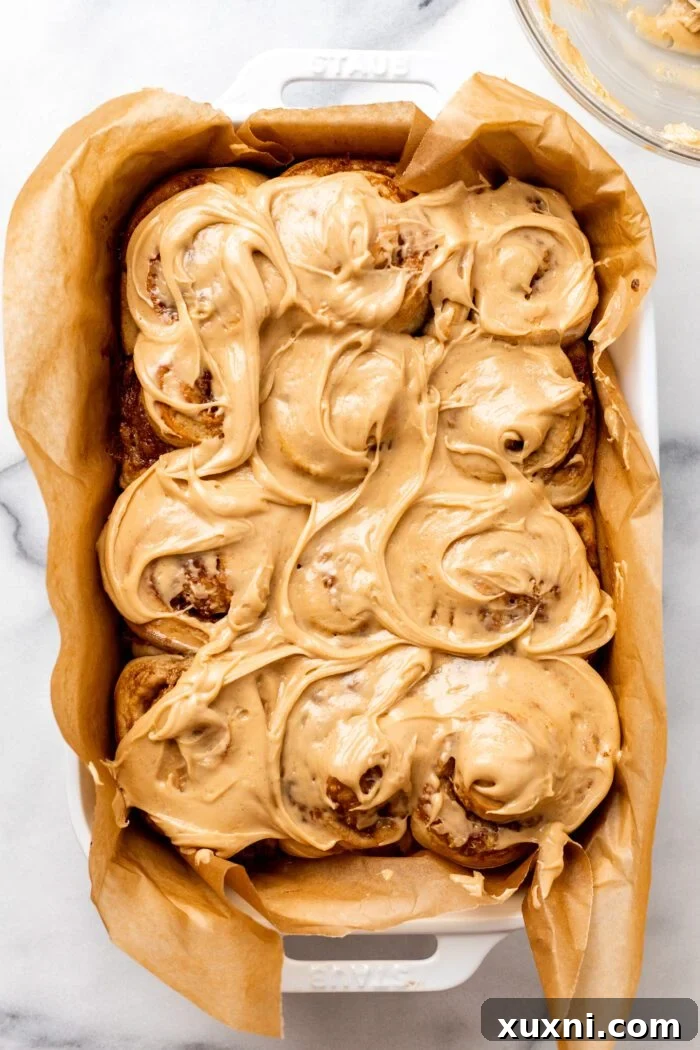 Irresistibly frosted vegan banana bread cinnamon rolls with peanut butter cream cheese frosting