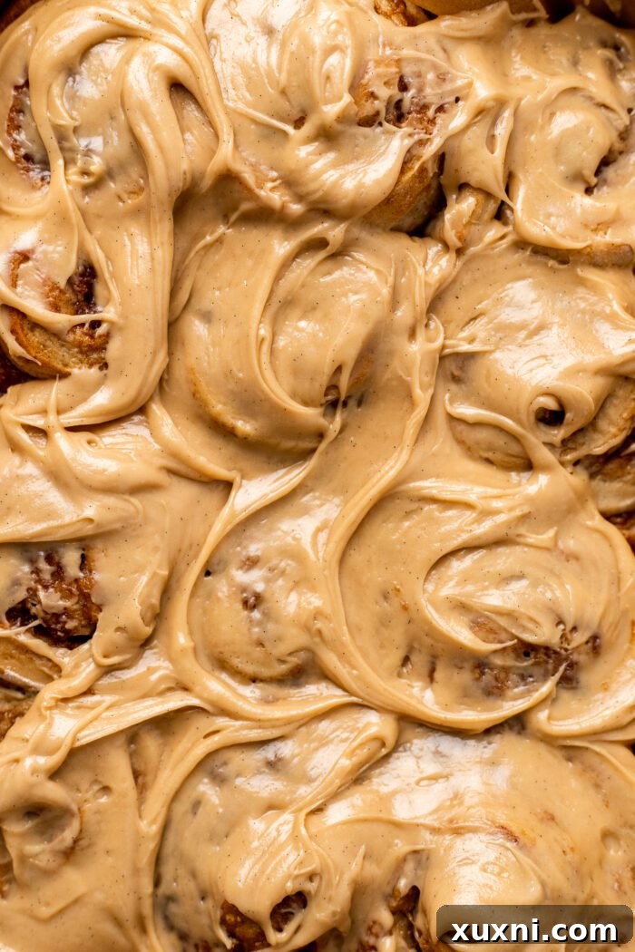 A delightful platter of frosted vegan banana bread cinnamon rolls