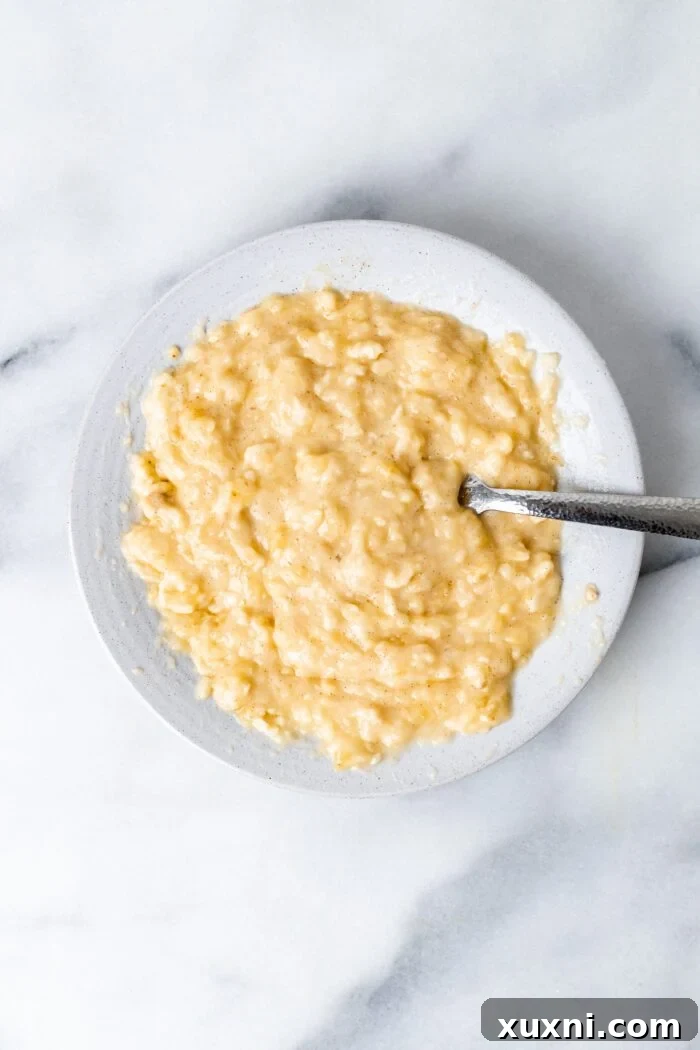 Bowl of freshly mashed banana for cinnamon roll filling
