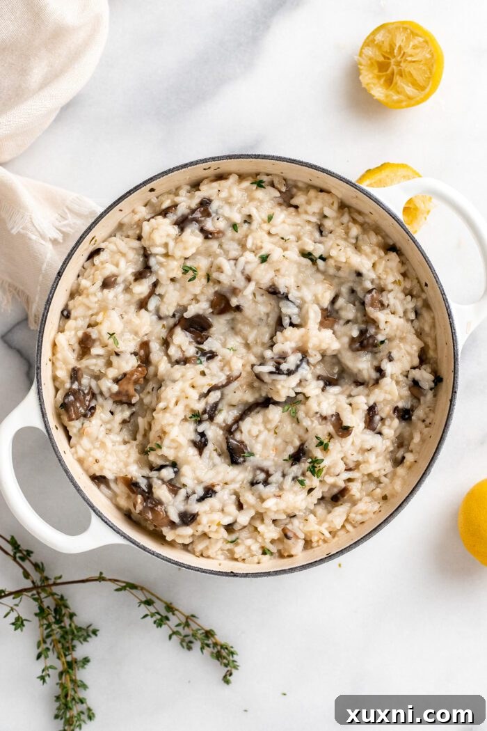 Finished vegan risotto cooking in a Dutch oven, creamy and ready for final additions.