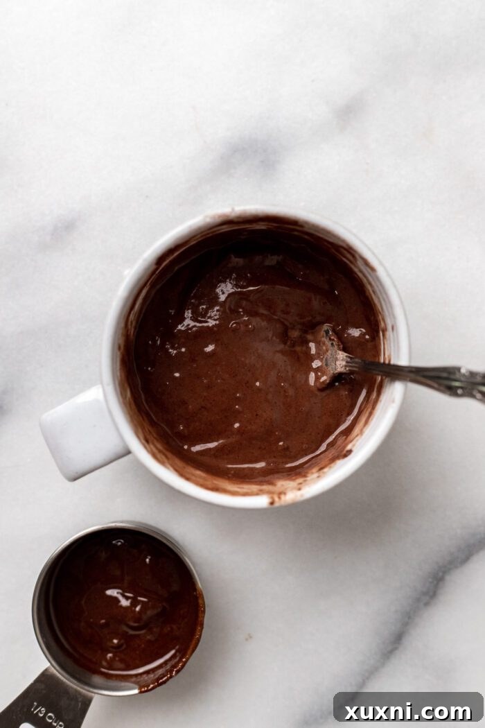 Mixed batter for Nutella mug cake, smooth and consistent