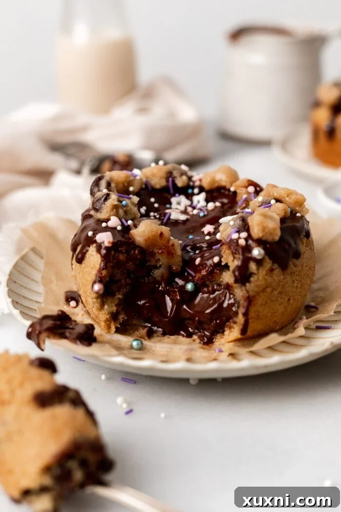 vegan mini cookie cake with nutella pouring out of it on a plate