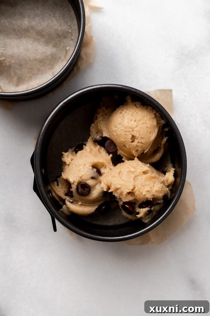 Scooped cookie dough in cake pan