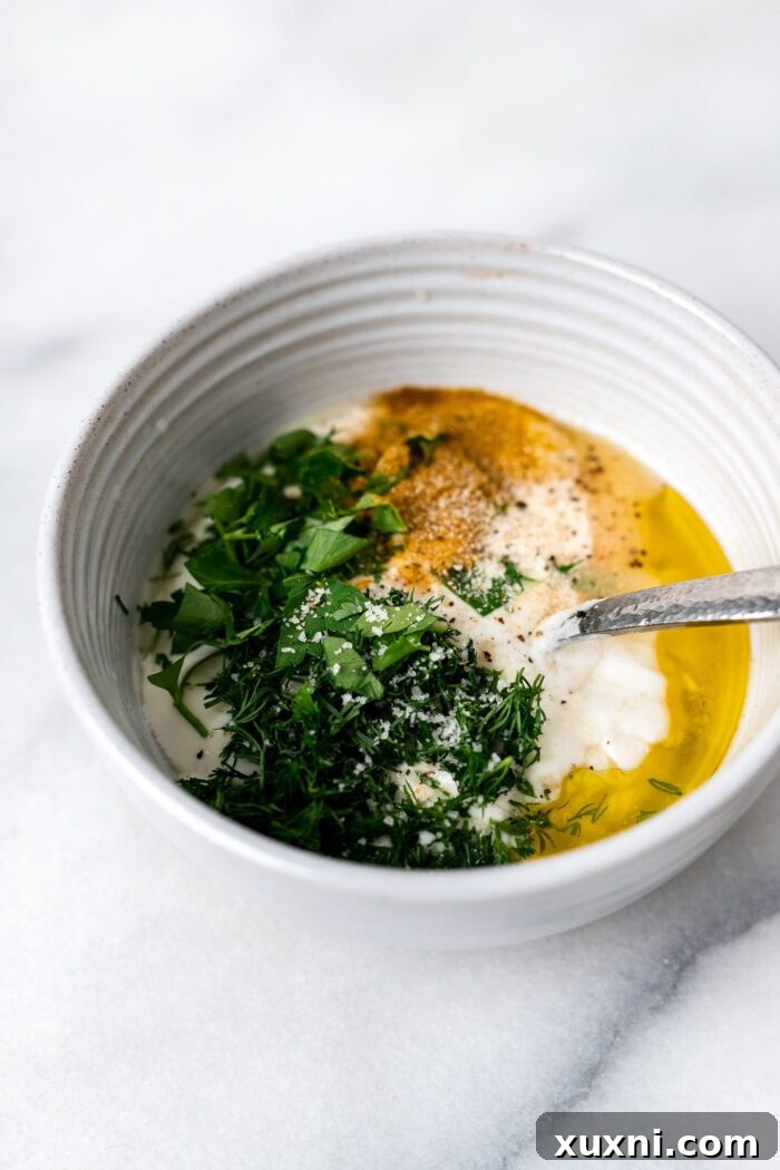 fresh ingredients for lemon yogurt dill sauce: yogurt, lemon, dill, olive oil