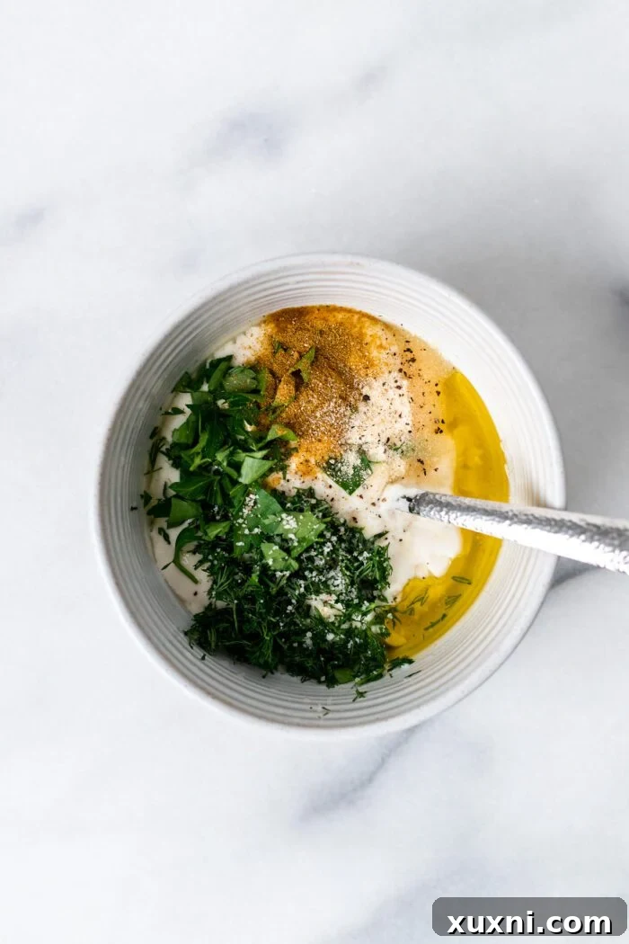 all ingredients for yogurt dill sauce added to a bowl