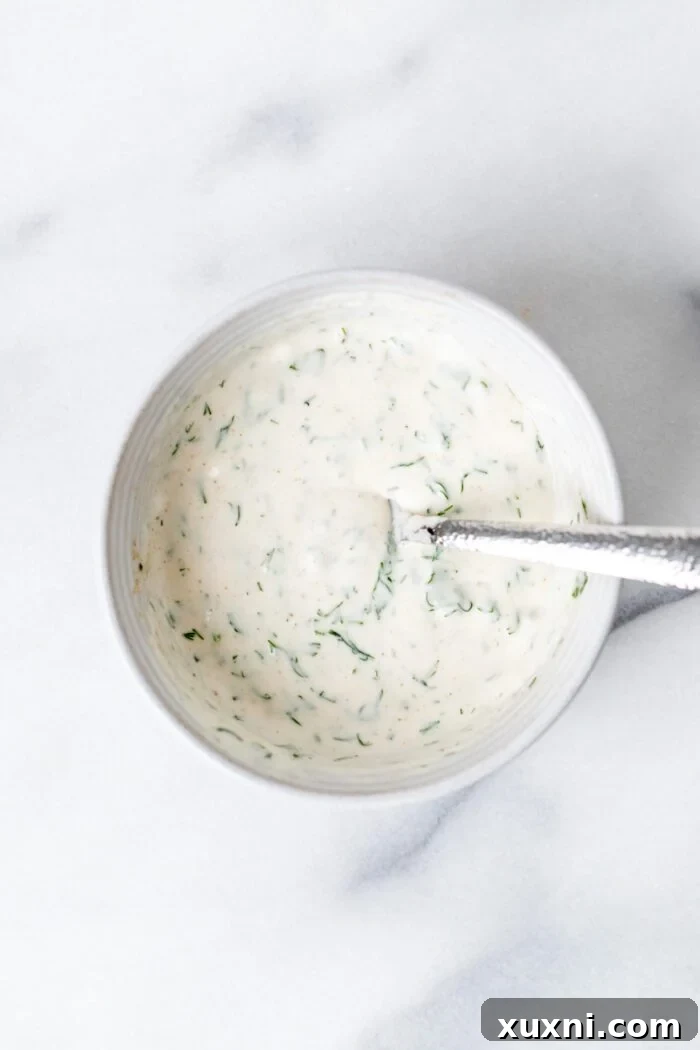 mixed yogurt dill sauce in a bowl, creamy texture