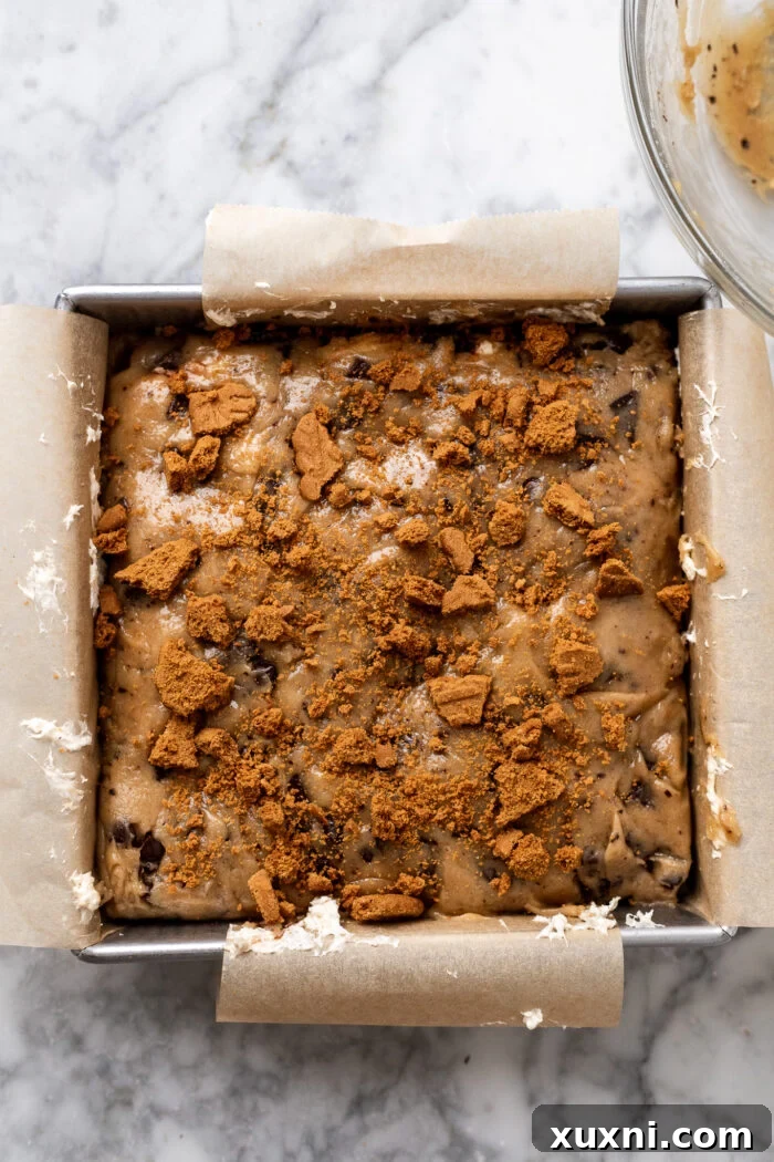 Close-up of the assembled vegan s'mores cookie bars before baking