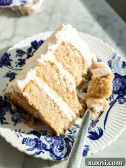 slice of vegan vanilla cake on a plate