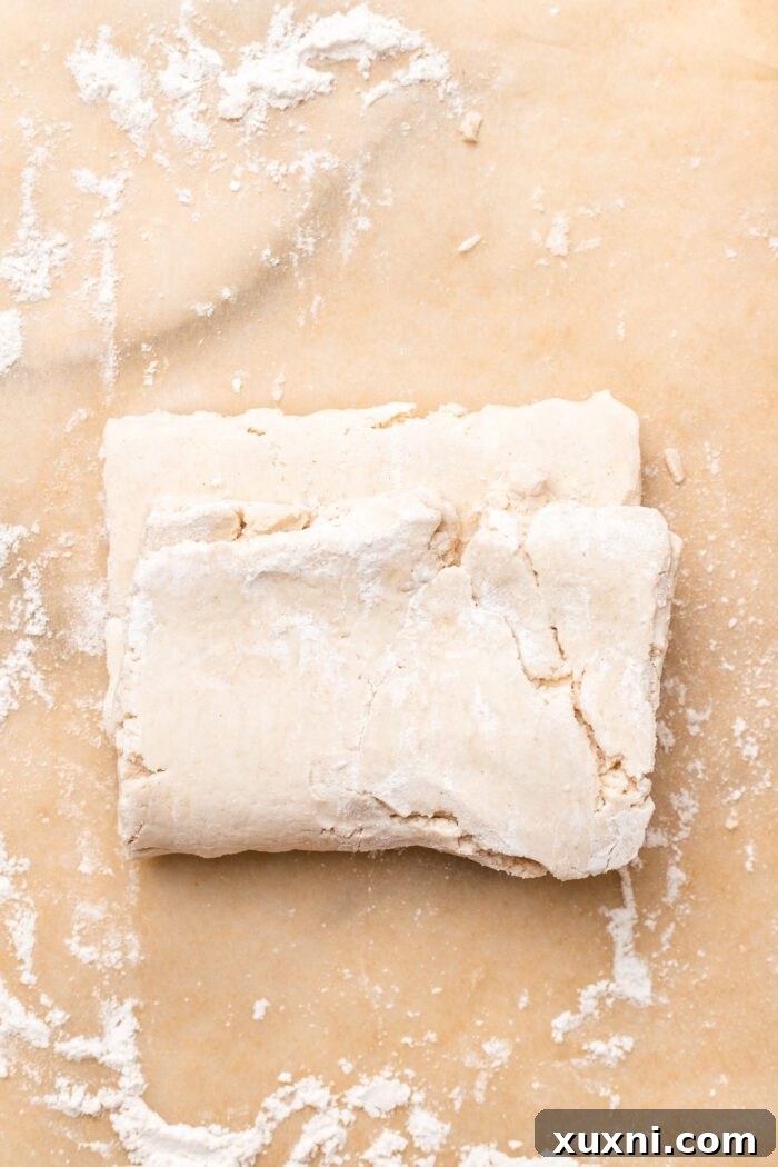 Second fold of the puff pastry dough, folding the bottom third up.