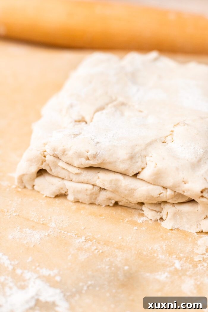 Laminated puff pastry dough rotated 90 degrees, ready for the next fold.