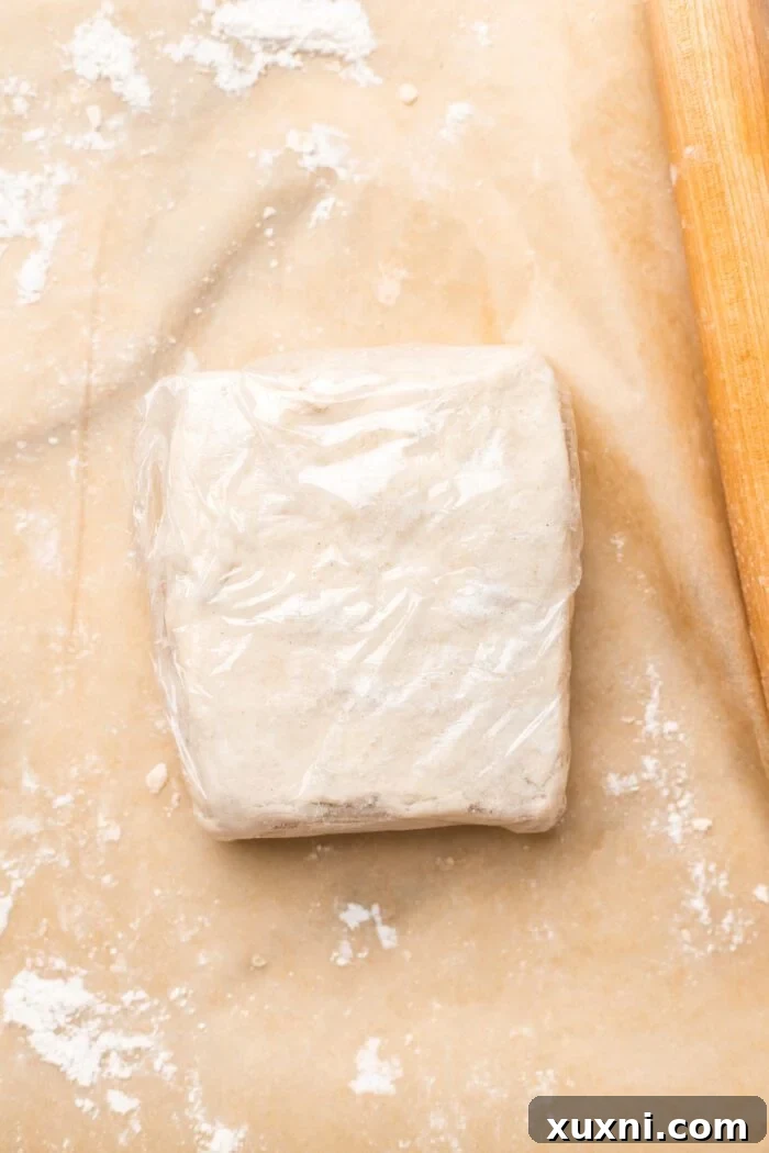 Wrapped and chilled gluten-free puff pastry dough, ready for use or storage.
