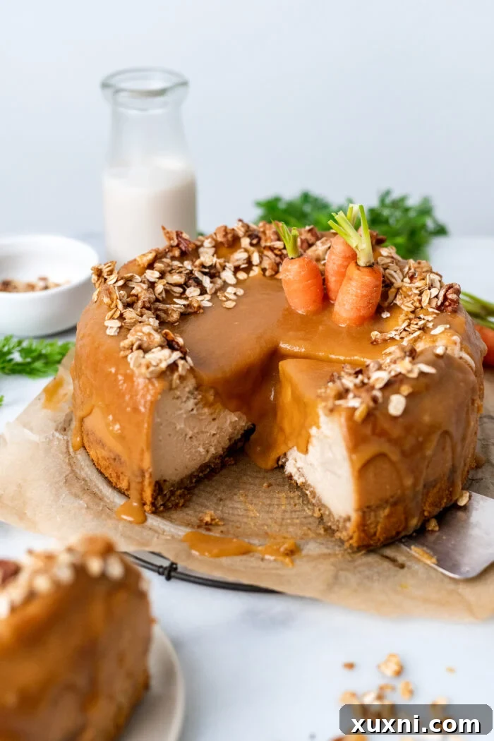 A stunning slice of vegan carrot cake cheesecake, showcasing its distinct layers and creamy texture.