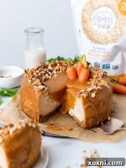 A perfectly plated slice of vegan carrot cake cheesecake